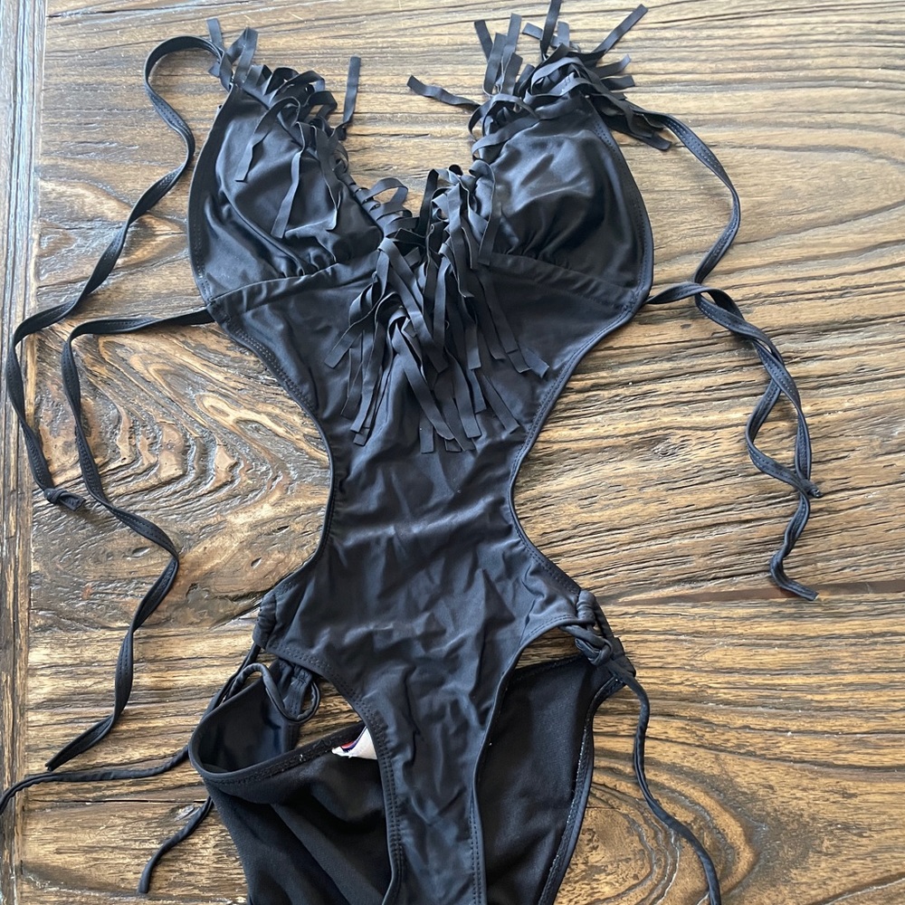 Like new fringy, one piece